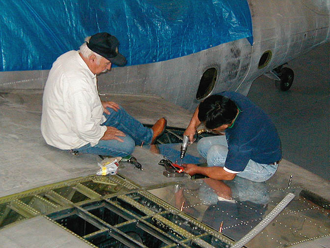 TBM_15.jpg - Drilling holes for the rivets and using clecos to hold panels in place